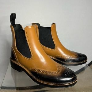 Rubber rain boots in worn condition. OBO.